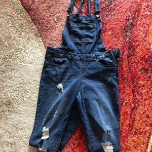 Fashion Nova dark blue overall with rips